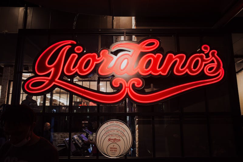 Pequod's pizza catering setup with deep dish pizzas